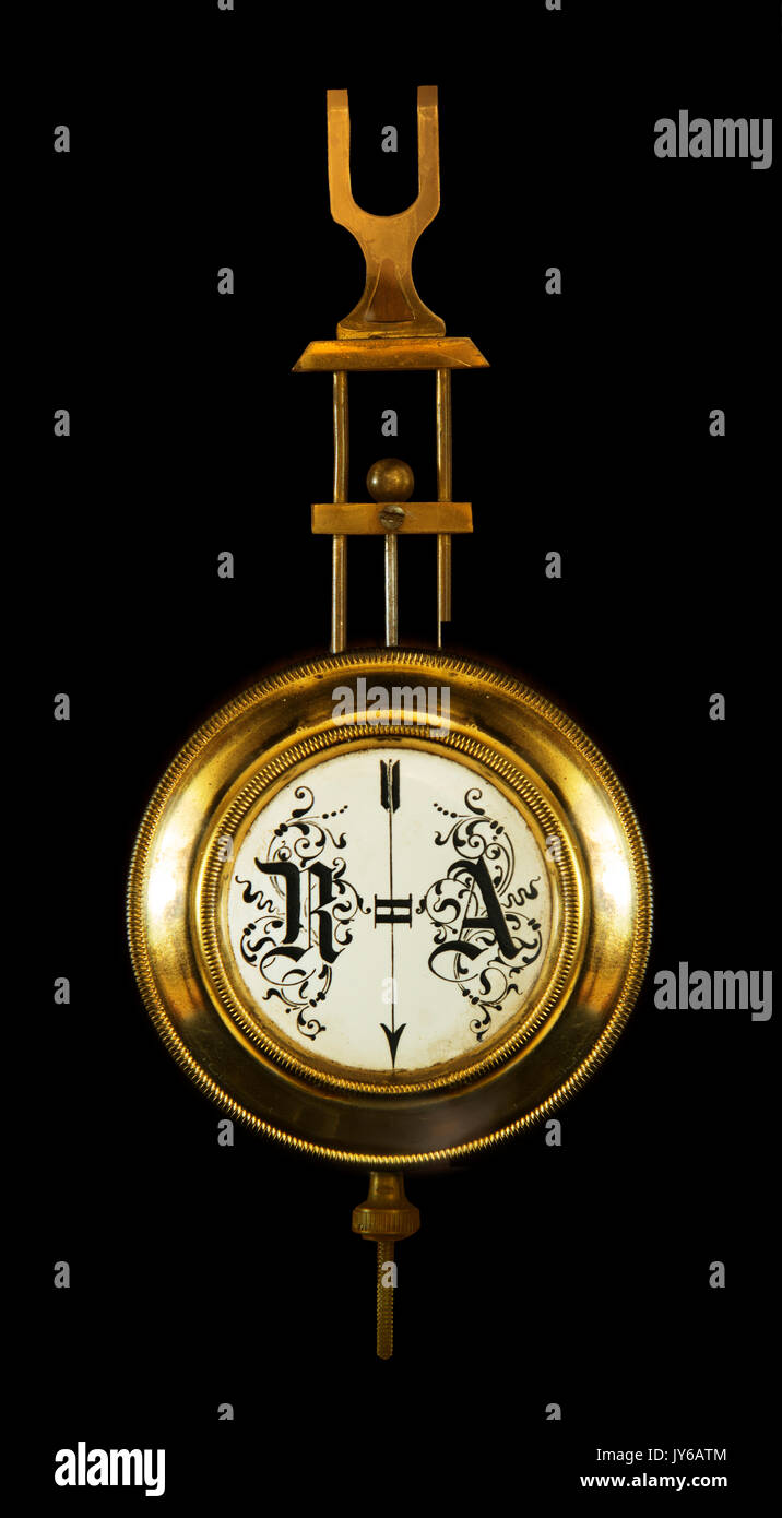 the pendulum wall clock. The end of the 19th century. Isolated on a black background Stock Photo