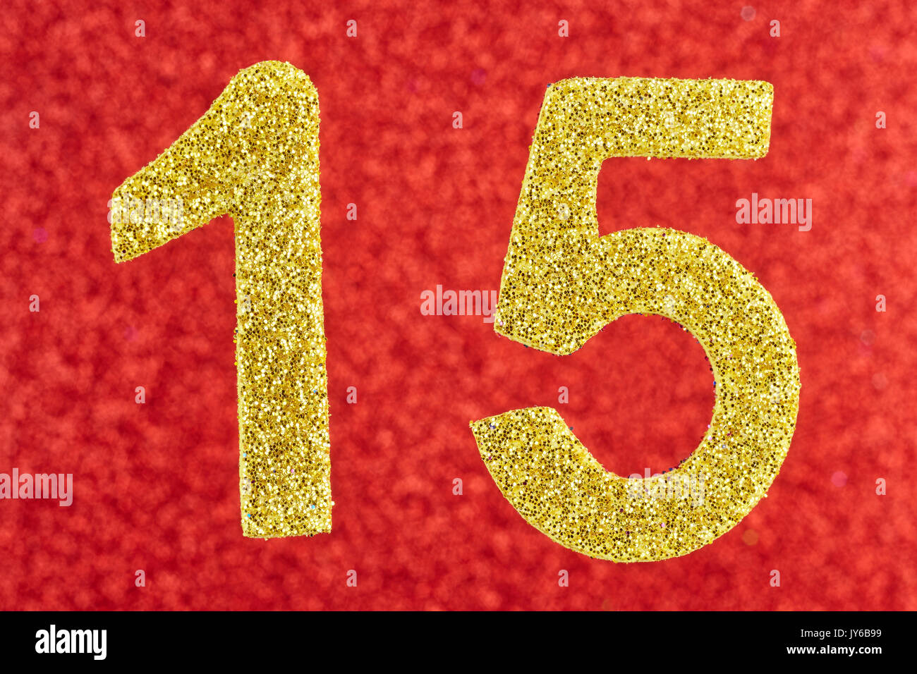 Number fifteen yellow color over a red background. Anniversary. Horizontal Stock Photo