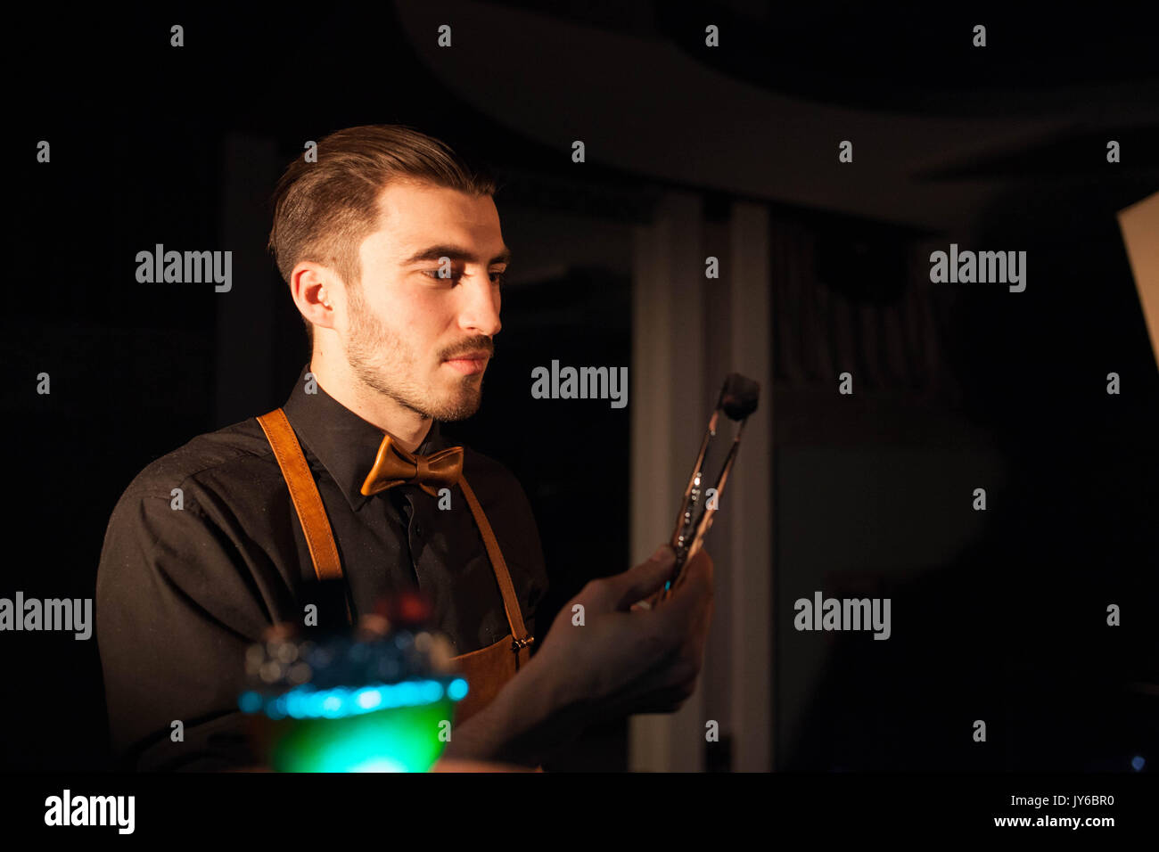 Hookah man holding a hookah ember Stock Photo Alamy