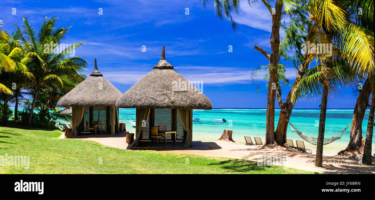 Tropical beach scenery with bungalows. Mauritius island Stock Photo