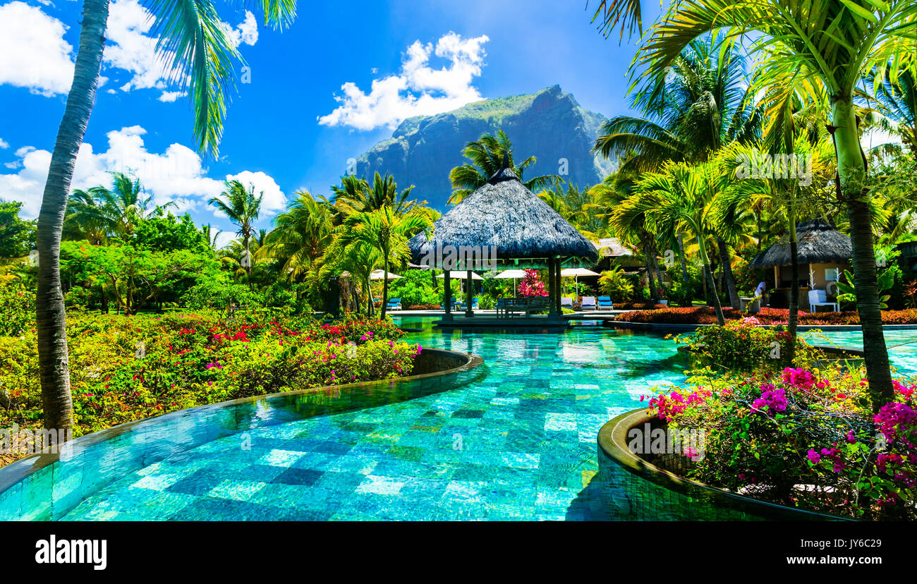 Luxury resort spa territory with gorgeous swim pool in Mauritius island. Tropical vacation consept Stock Photo