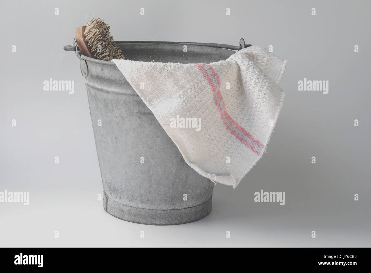 Oldfashioned zinc bucket with cloth and brush Stock Photo