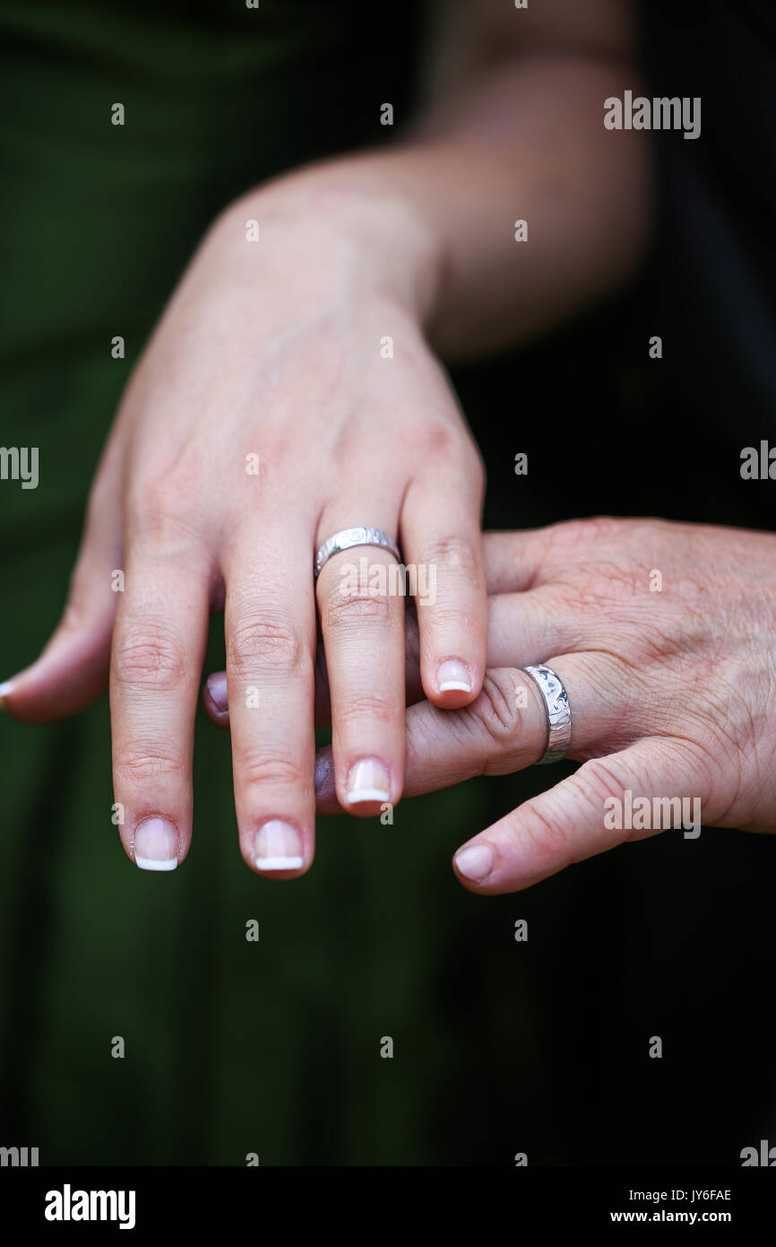 A couple wearing their wedding rings Stock Photo