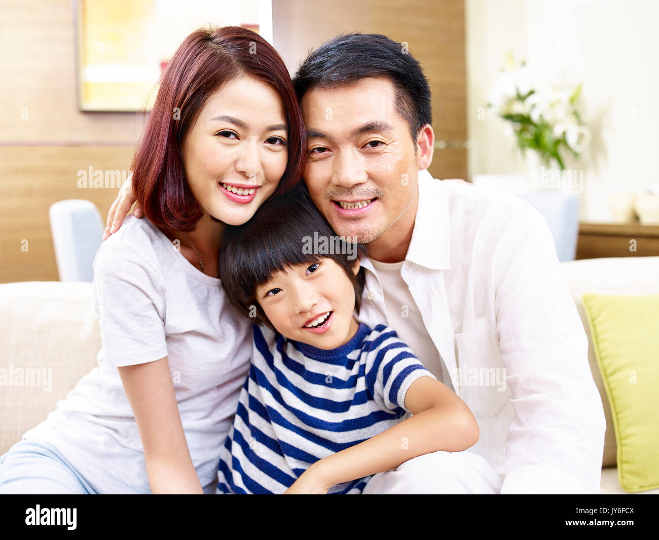 portrait of asian father mother and son looking at camera smiling. Stock Photo