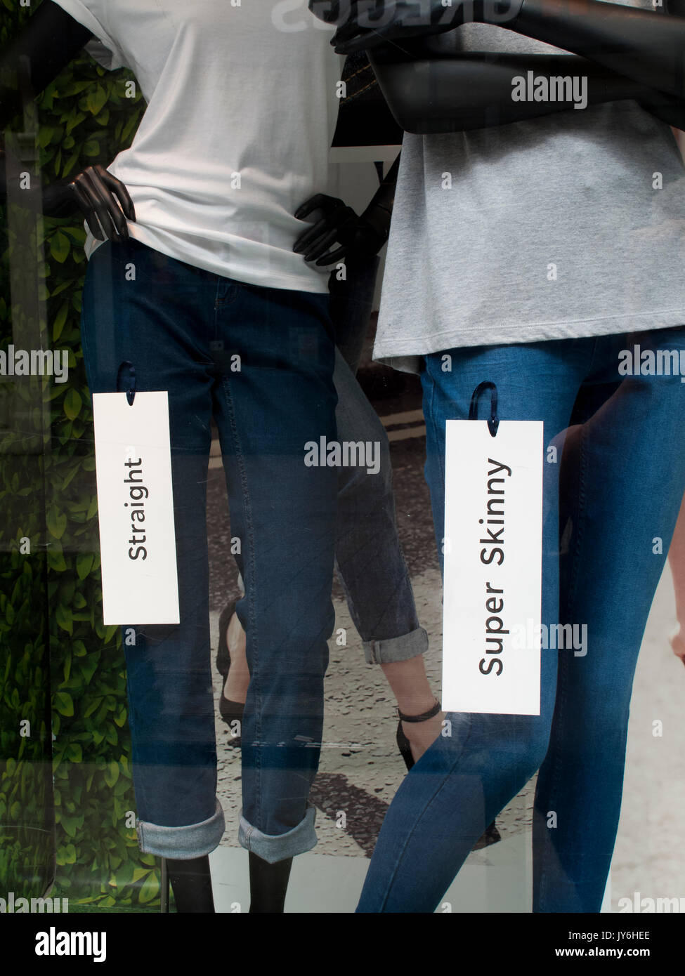 Super skinny and straight legged jeans in Marks and Spenser shop window display Stock Photo