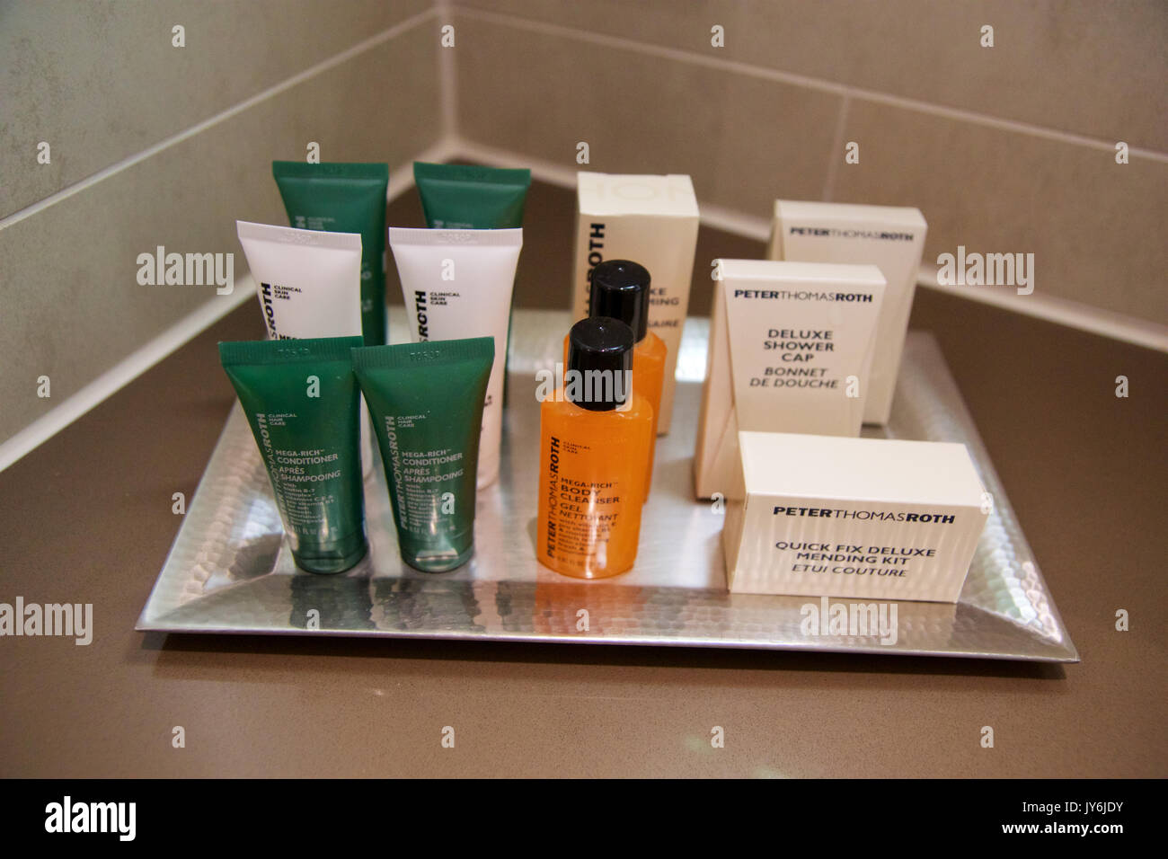 MAINZ, GERMANY - JUL 7th, 2017: Shower amenity set at a luxury hotel, A bar of soap, shampoo and body lotion Stock Photo