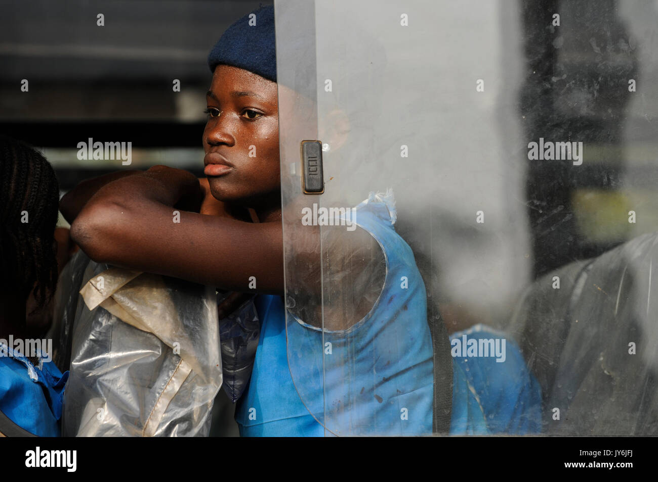 SIERRA LEONE, Kent, school girl in blue uniform in public bus / SIERRA LEONE, Kent, Maedchen in einem Bus Stock Photo