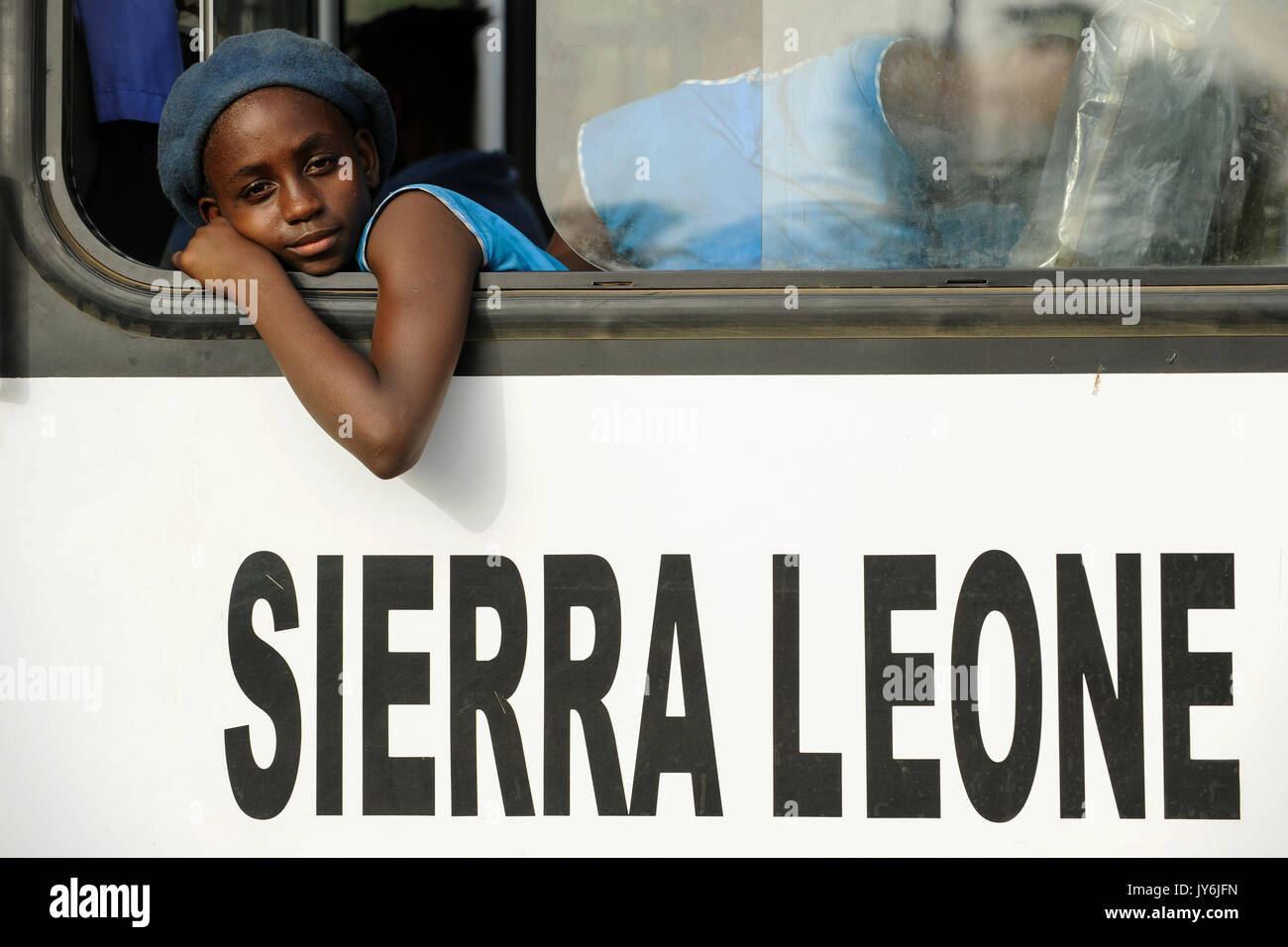 SIERRA LEONE, Kent, school girl in blue uniform in public bus / SIERRA LEONE, Kent, Maedchen in einem Bus Stock Photo