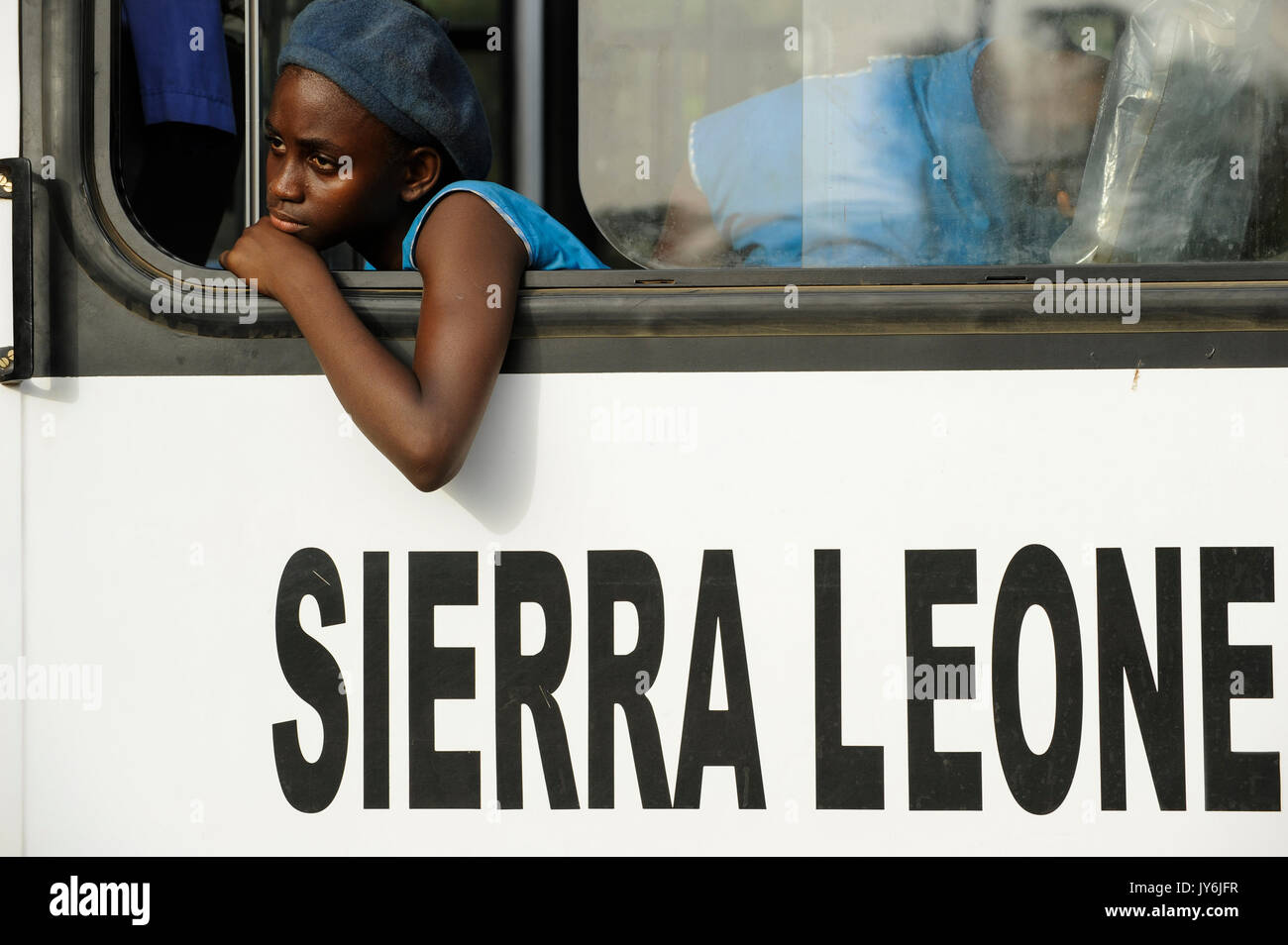 SIERRA LEONE, Kent, school girl in blue uniform in public bus / SIERRA LEONE, Kent, Maedchen in einem Bus Stock Photo