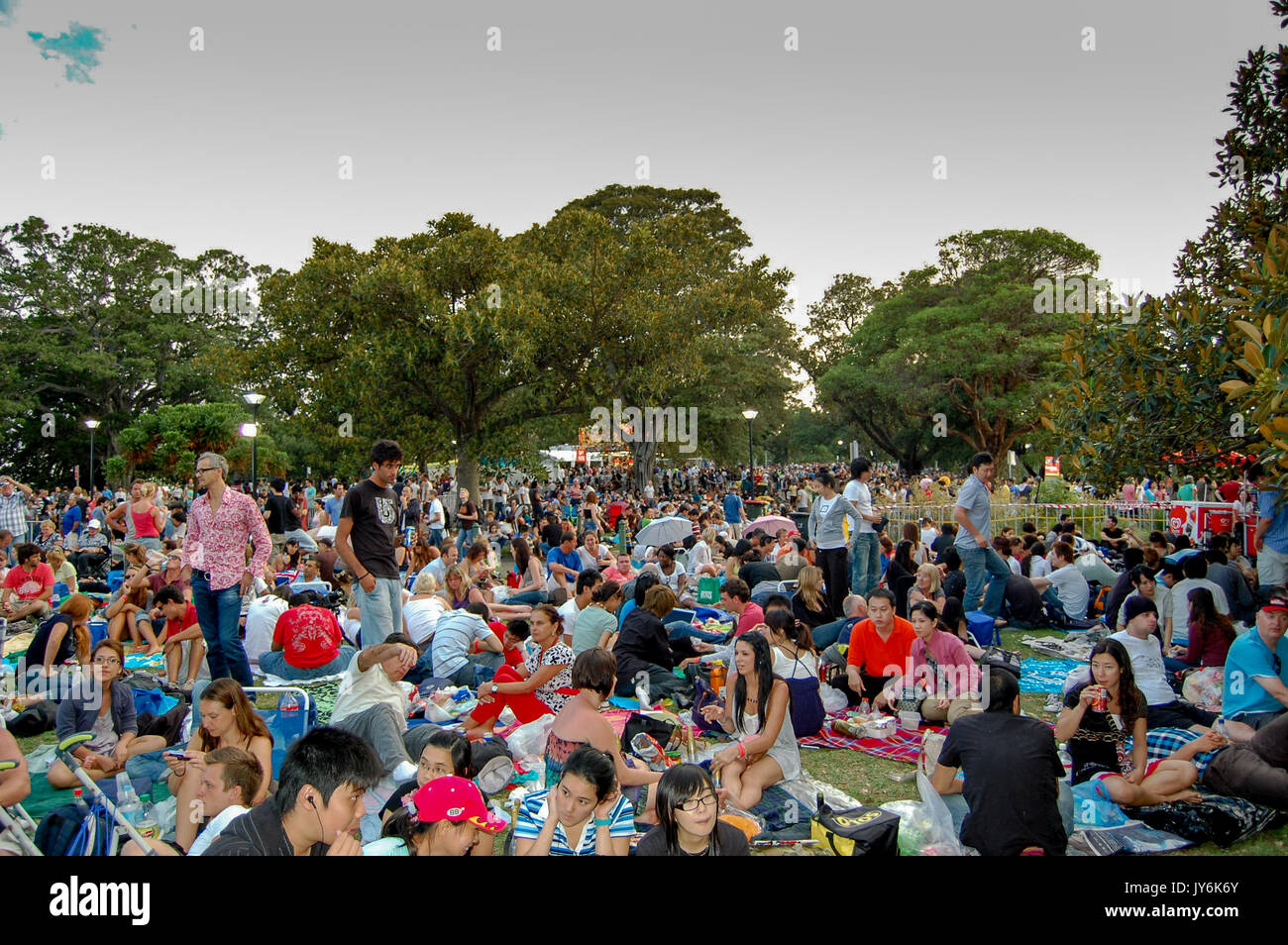 A large crowd waits in anticipation for the new years eve fireworks display in Sydney, Australia Stock Photo