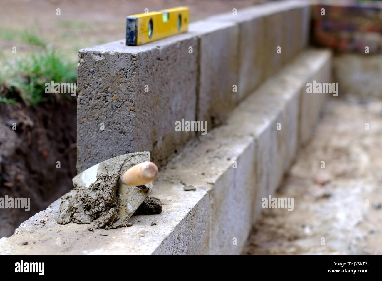 Bricklaying tools and mortar on a building site Stock Photo Alamy