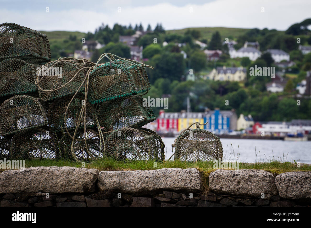 Crab or Lobster pots on the harbour in Tobermoray bay on the Isle of Mull in the Inner Hebrides on the West coast of Scotland Stock Photo