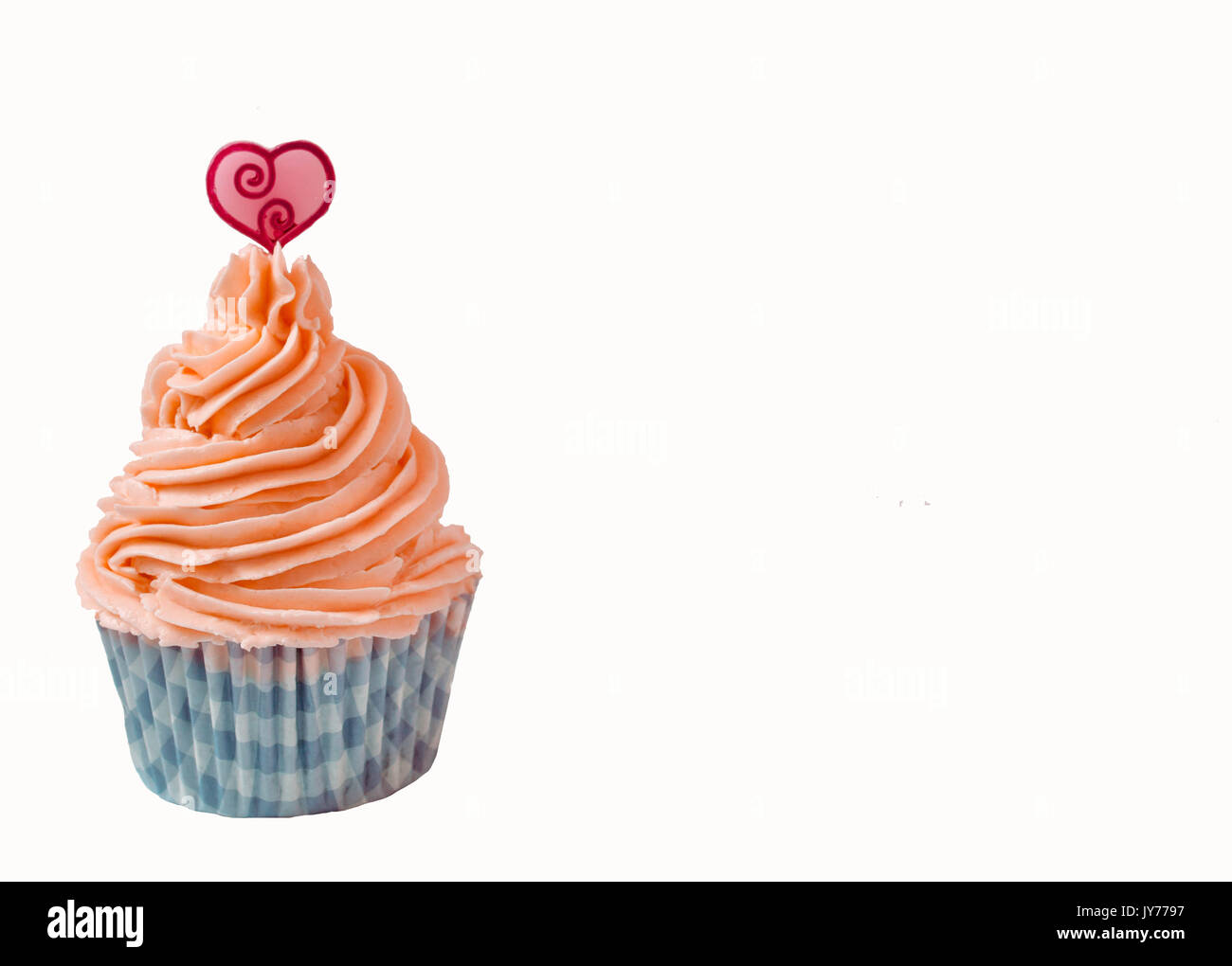 strawberry buttercream cupcake with a heart on top in white background Stock Photo