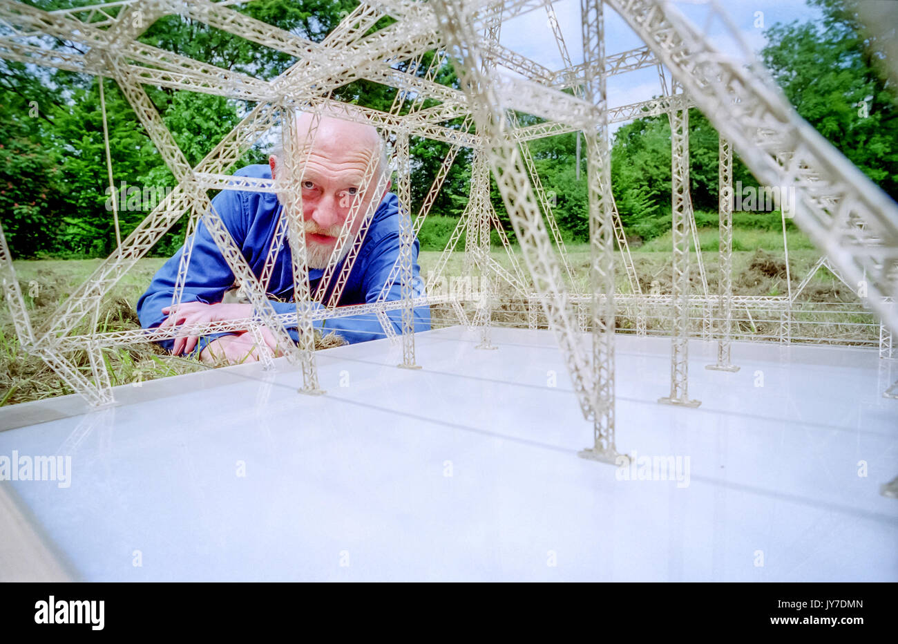 Designer Bill Harkin, designer of the Glastonbury Festival's Pyramid Stage, with the original scale model he made. Stock Photo
