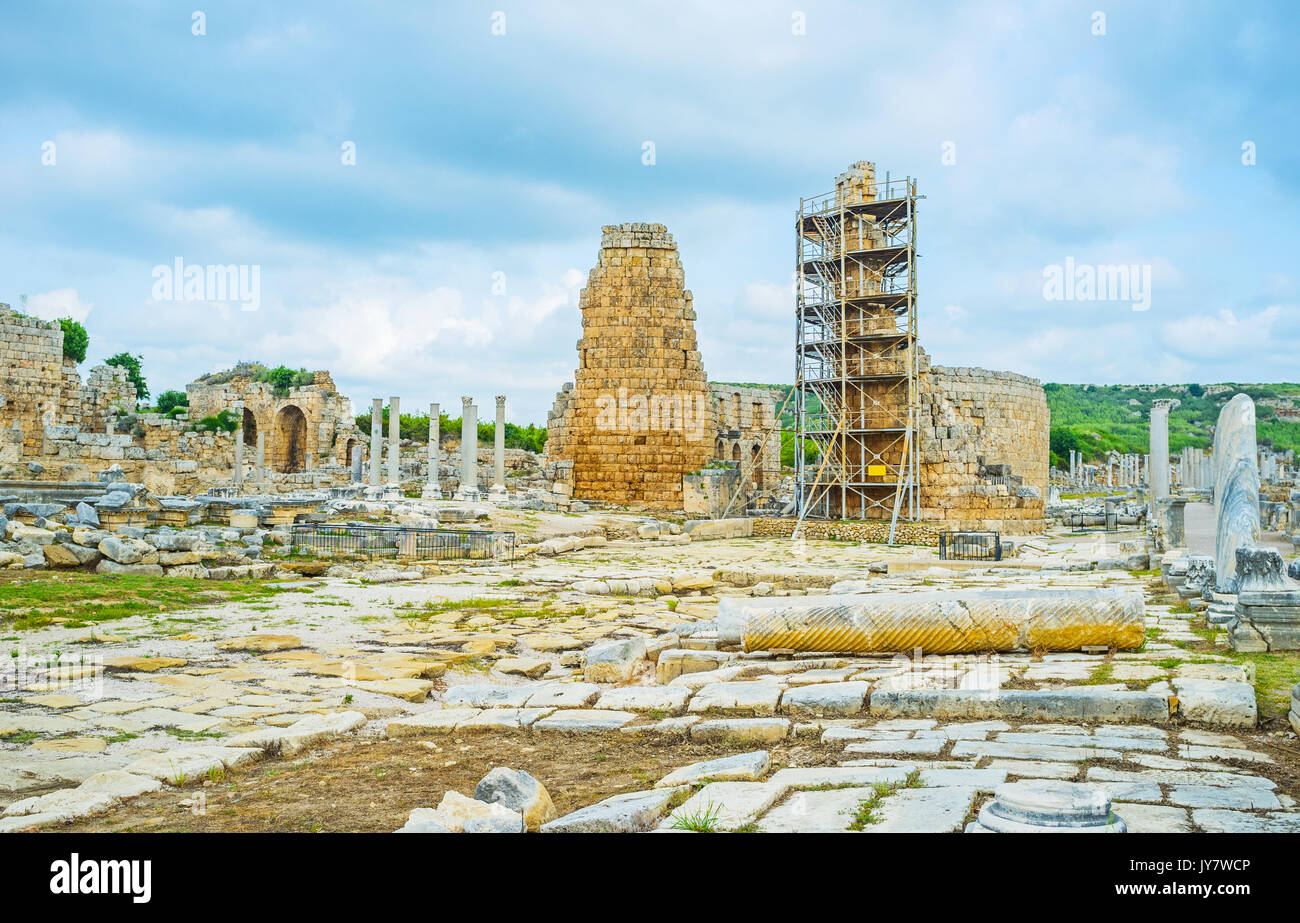 The walk among the ancient stone ruins of Pamphilyan city of Perge, Antalya, Turkey. Stock Photo