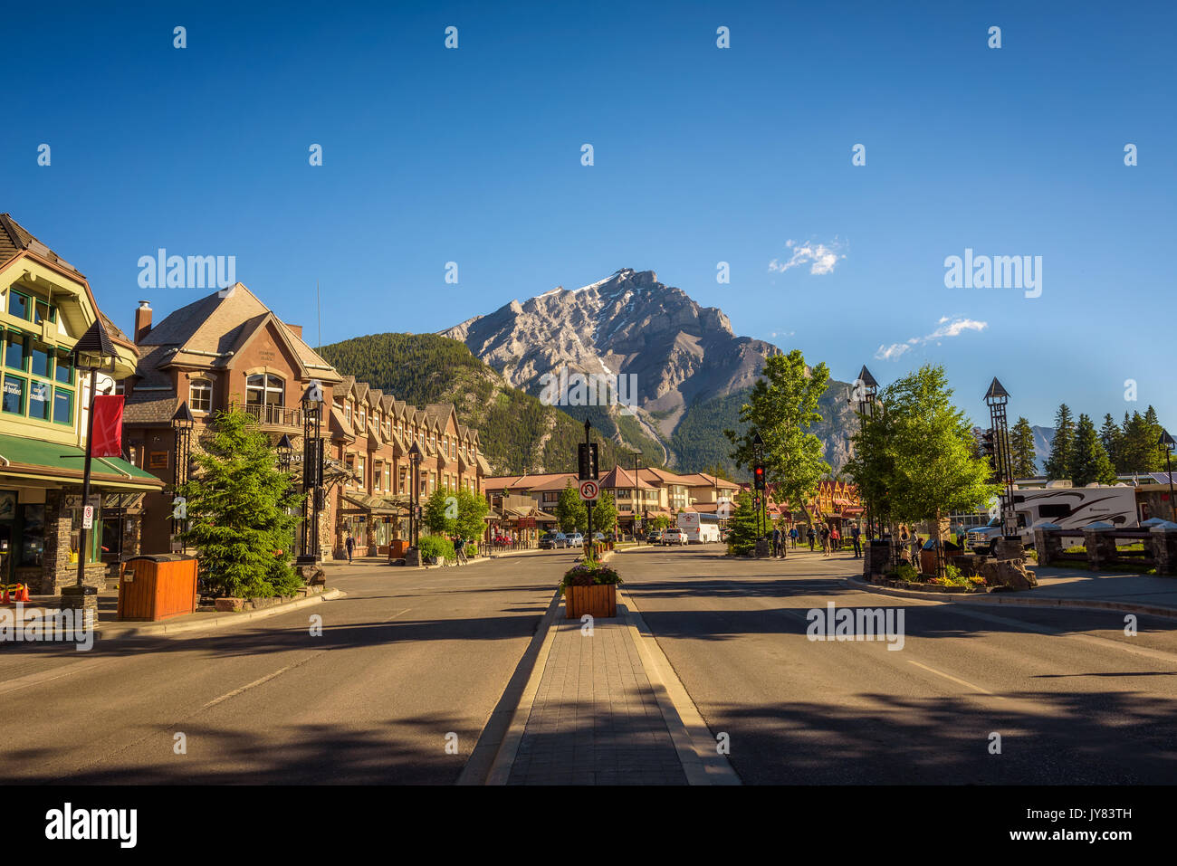 BANFF, ALBERTA, CANADA - JUNE 27, 2017 :  Scenic street view of the Banff Avenue in a sunny summer day. Banff is a resort town and popular tourist des Stock Photo