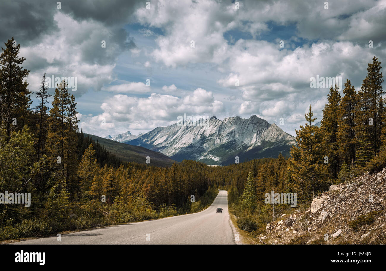 Scenic view of the road and canadian rockies on Icefields Parkway. Stock Photo