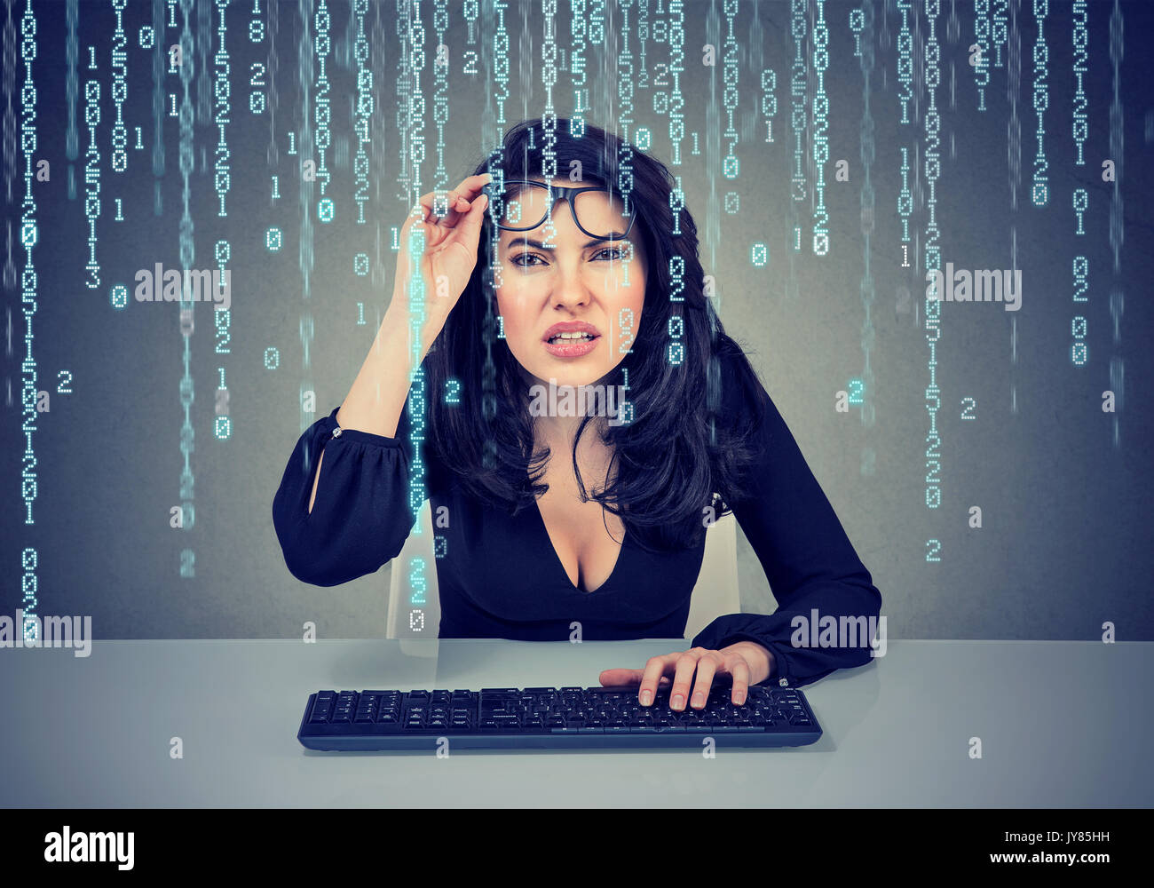 Confused girl coding on the computer Stock Photo Alamy