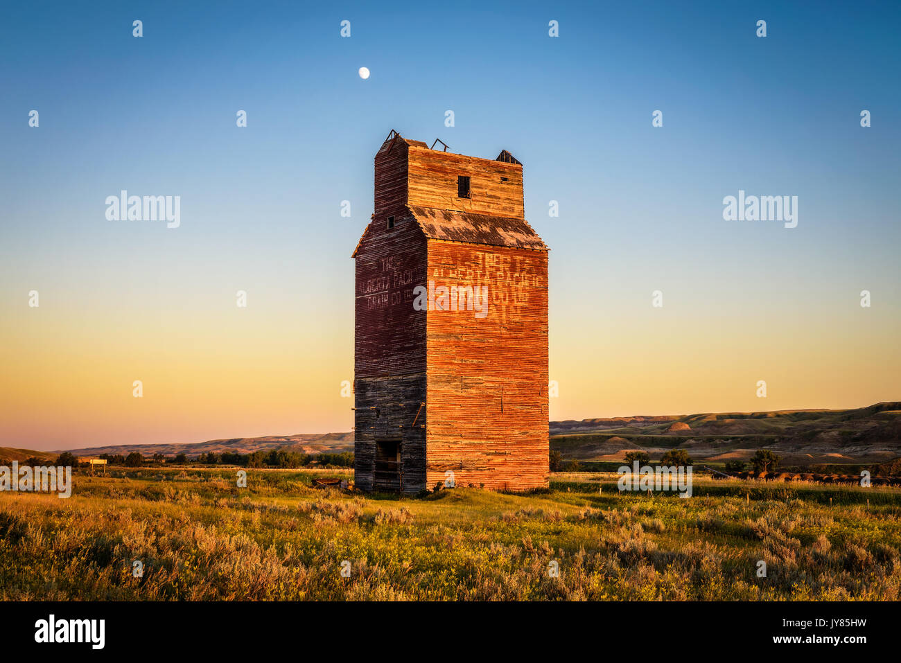 Abandoned grain elevator in the ghost town of Dorothy in Canada at sunset. Stock Photo