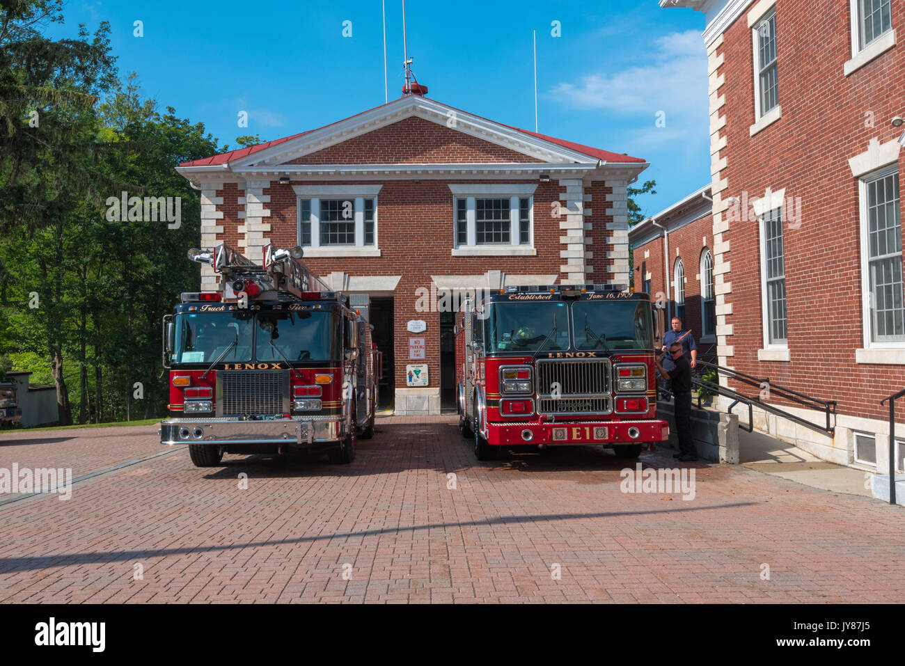 Lenox MA, USA 8/17/2017 -- Two fire engines are parked ouside the firehouse in Lenox MA. Editorial Use Only Stock Photo