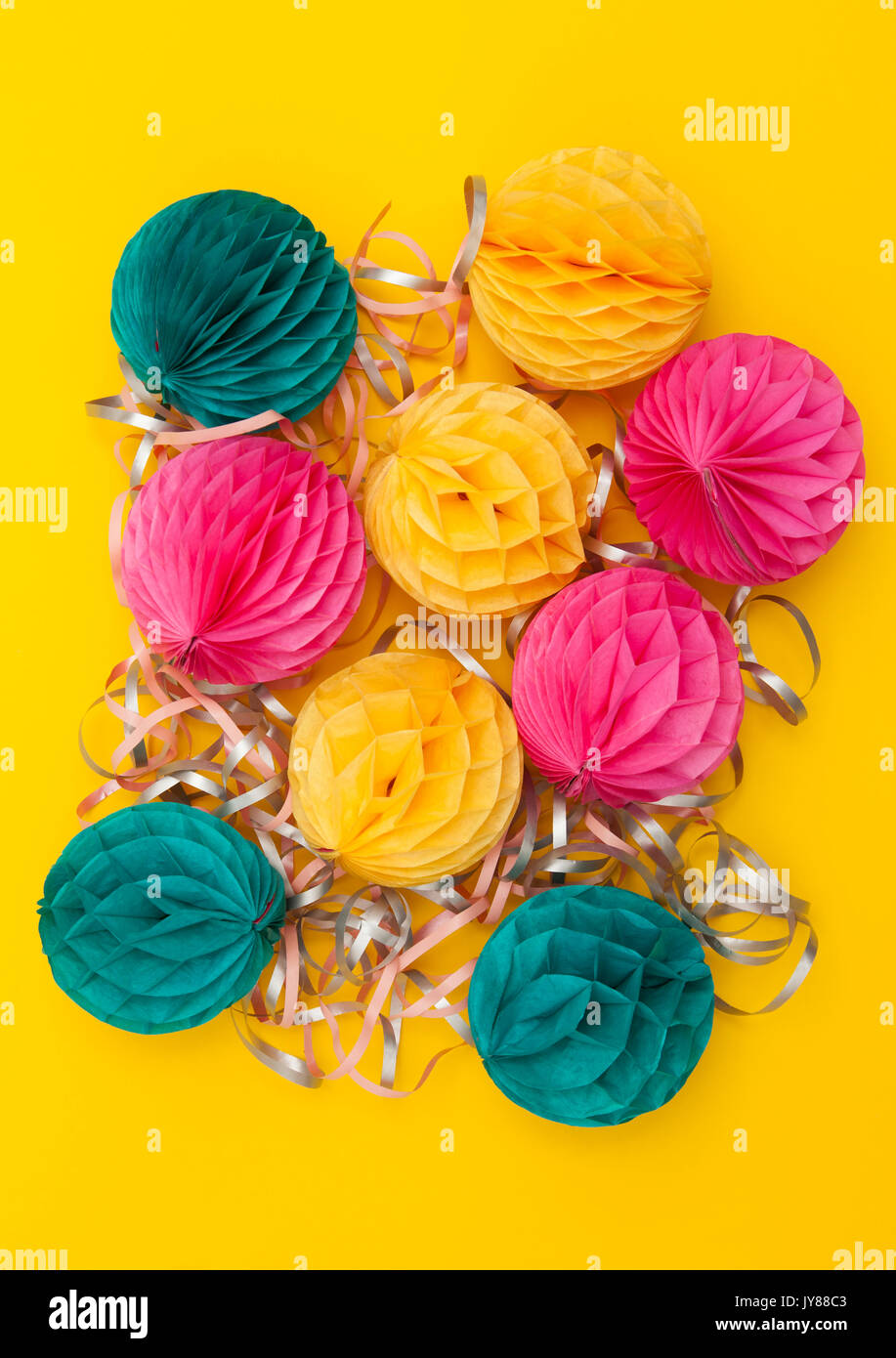 Bright party honeycomb pom pom decorations Stock Photo - Alamy