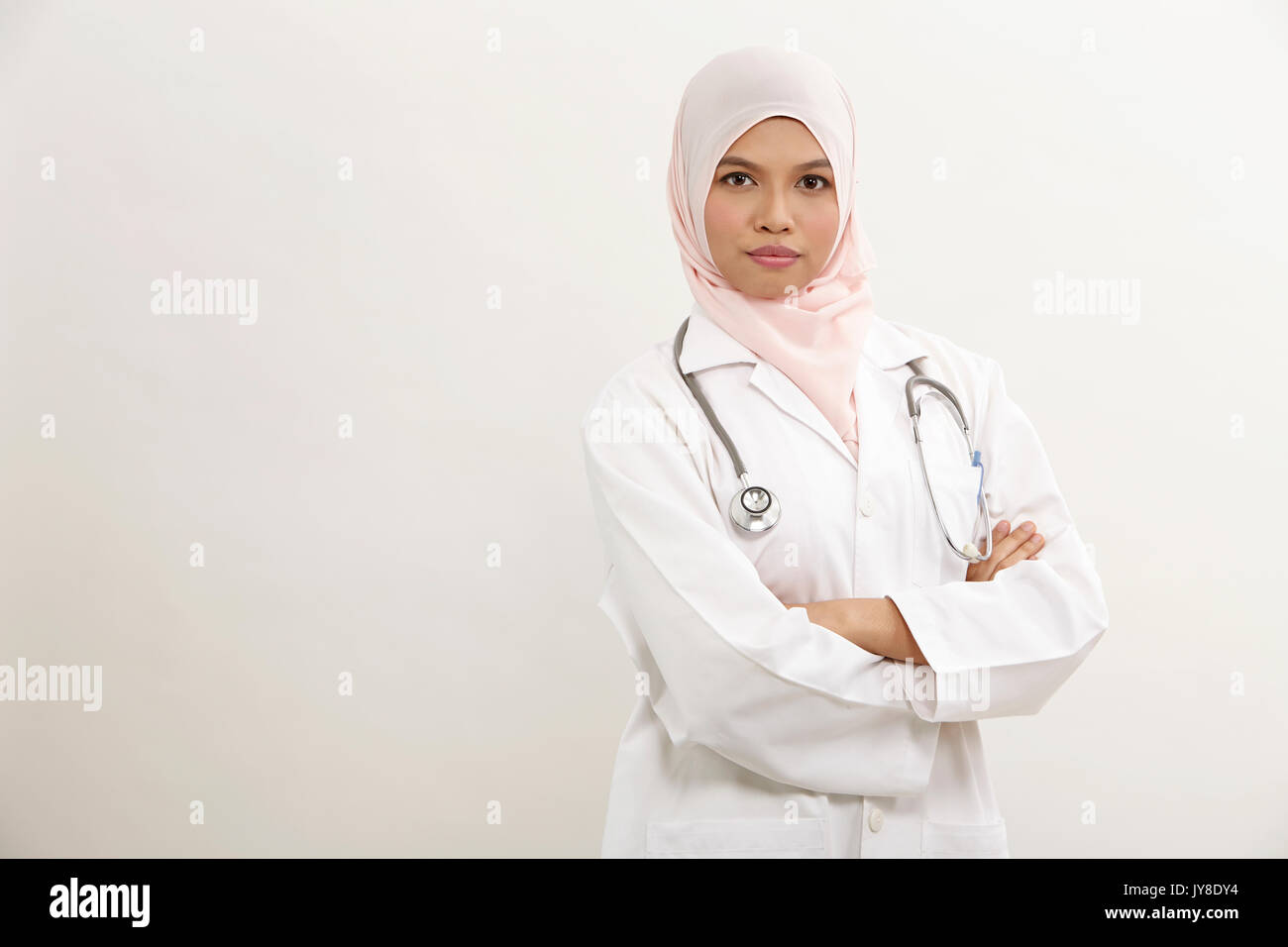 Malay female doctor on the white background Stock Photo Alamy