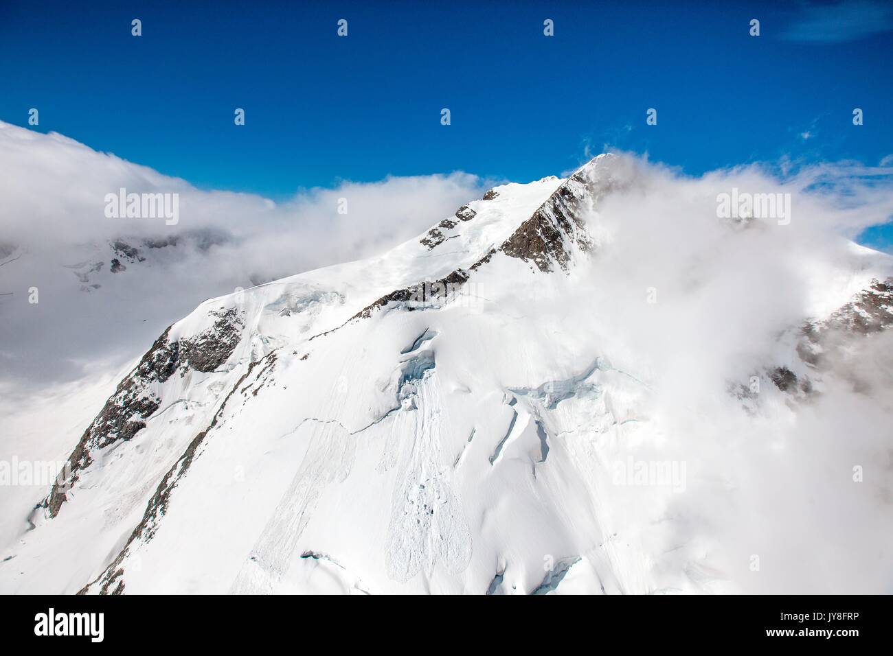 Aerial view of Pizzo Bernina covered with fog Engadine Switzerland Europe Stock Photo
