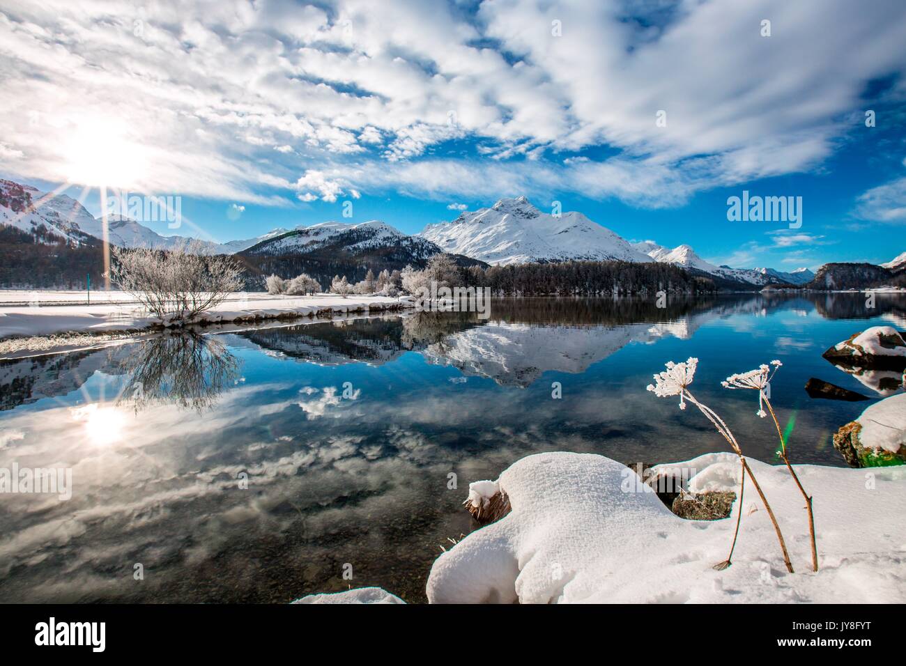 Sunburst shot on the banks of Lake Sils, Engadine, Switzerland Stock Photo