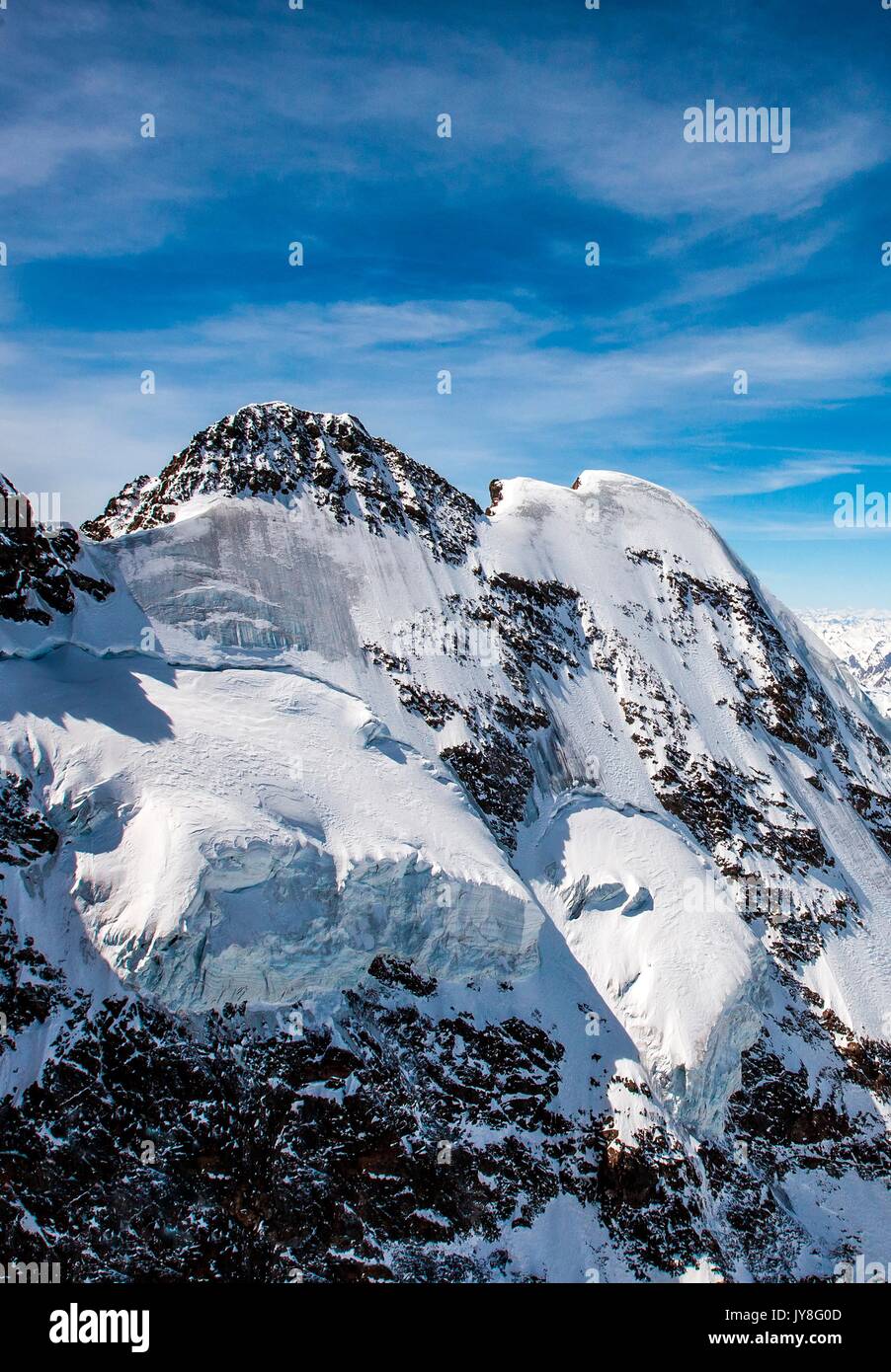 Aerial shot of the north wall of Piz Roseg and its glacier in Engadine, Switzerland Europe Stock Photo