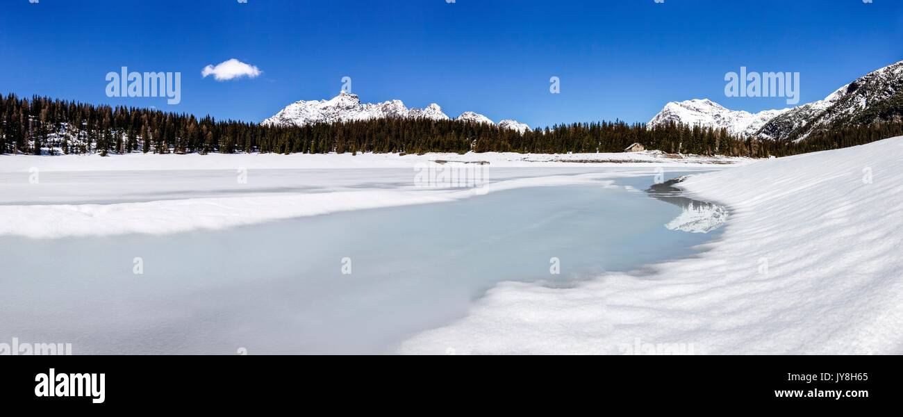 A panoramic view of Lake Palu during the thawing season in Valmalenco, Valtellina, Italy Stock Photo