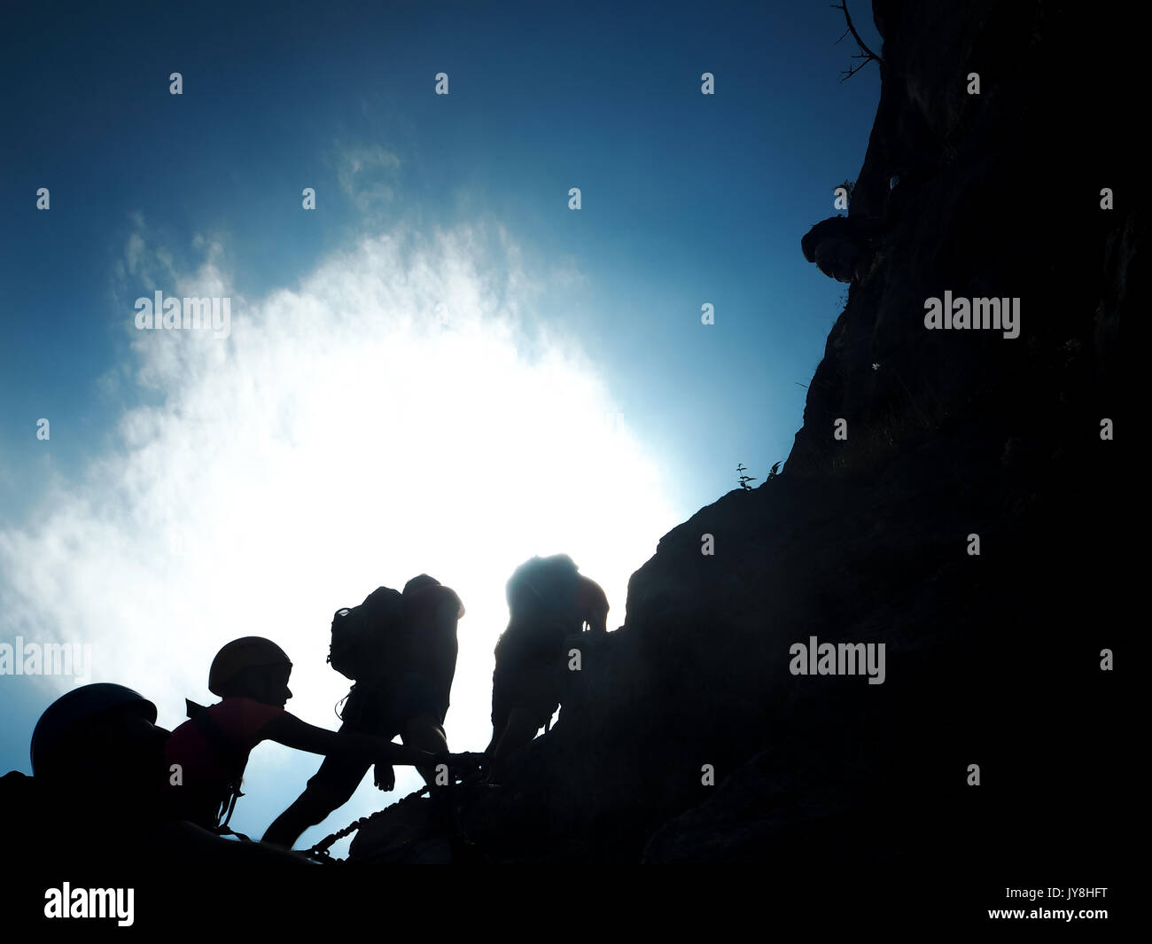 Mondsee and Attersee, Alps, Austria, Europe, Summer 2017: [ climbers climbing on rocky wall, hiking tour, dachenwand rock, via ferrata, Halstatt regio Stock Photo