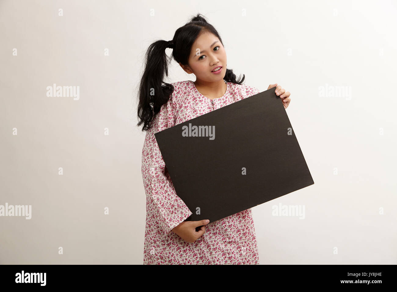 malay woman a holding placard Stock Photo Alamy