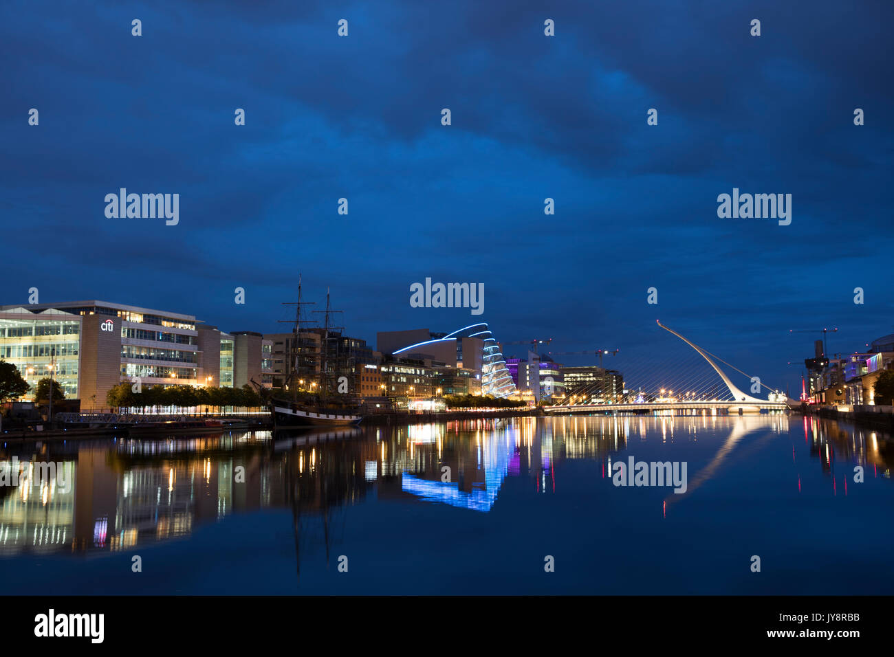 Electric Blue night over Dublin's River Liffey and Samuel Beckett Bridge, Convention Centre. Stock Photo
