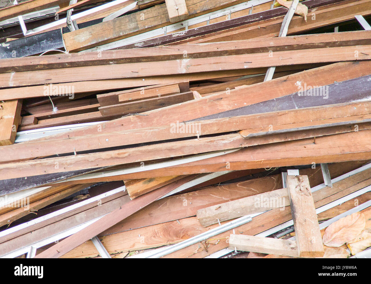 Large lumber pile from the broken house to preparation for renovation