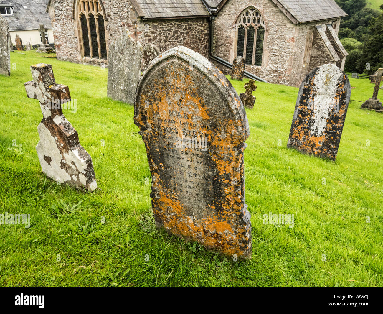 Gravestones in the churchyard of St.Peter's Church in Exton, Somerset. Stock Photo