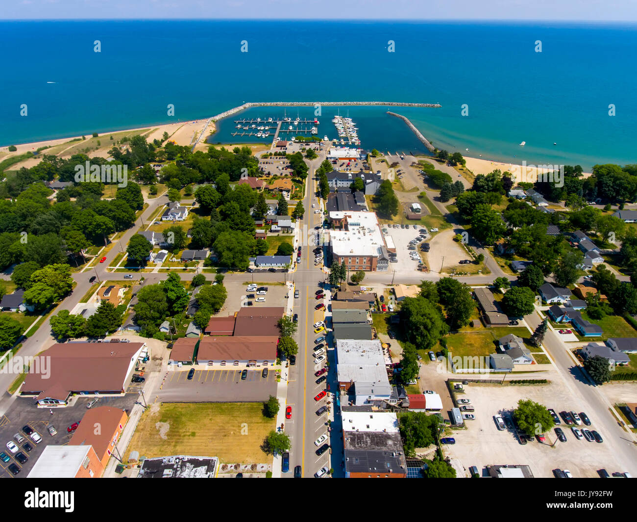 Aerial view of Lexington Michigan on Lake Huron showing a man made harbor and how it protects a marina from wind and waves Stock Photo