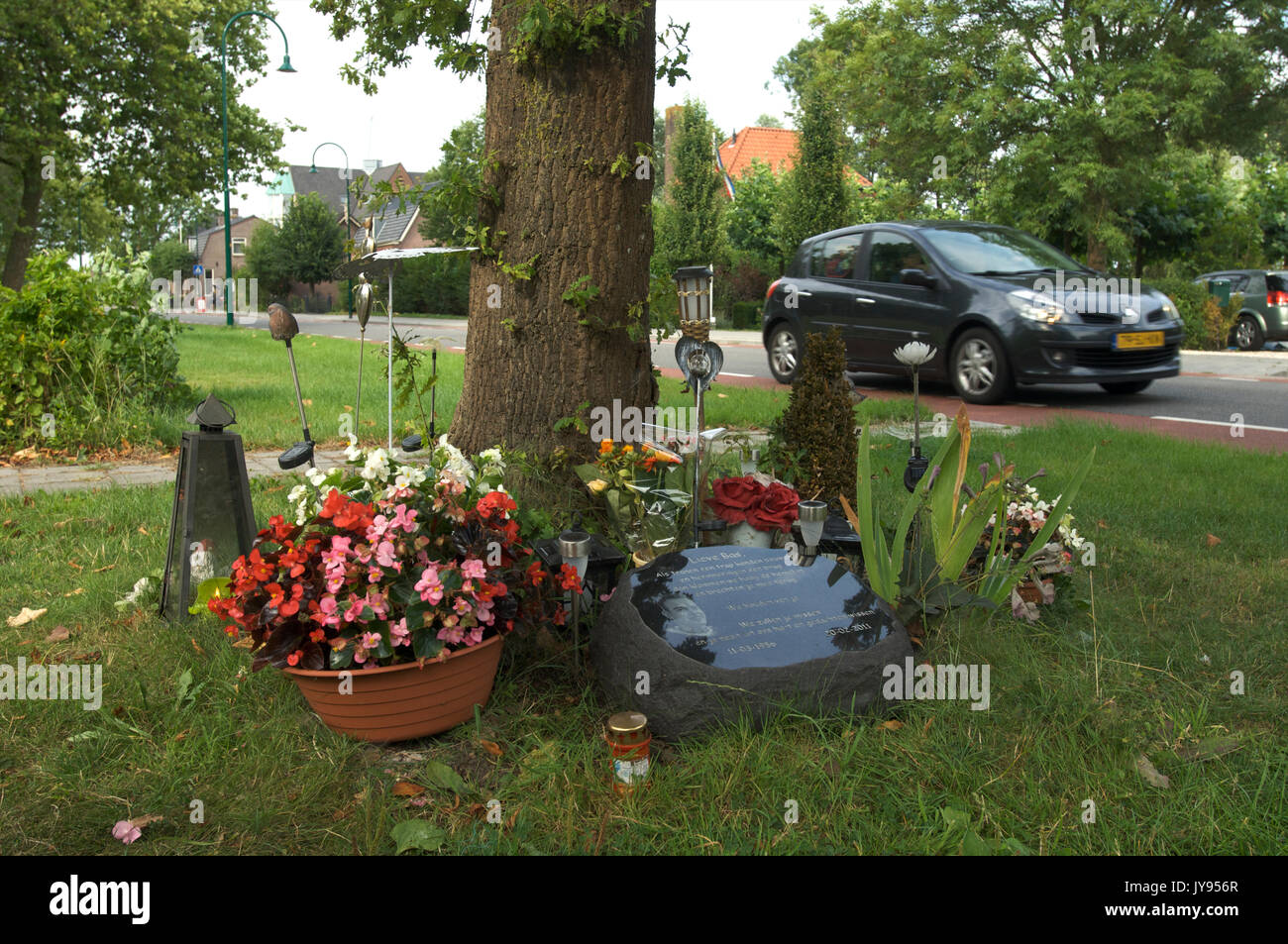 A monument next to the road in memory of a person who died here in a car crash, The Netherlands Stock Photo