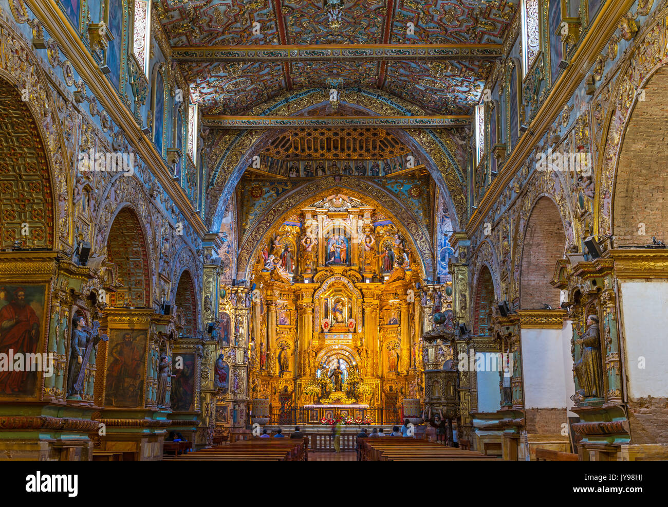 The baroque style and gold leaf decorated altar of the Saint Francis church and convent in the historic city center of Quito, Ecuador. Stock Photo