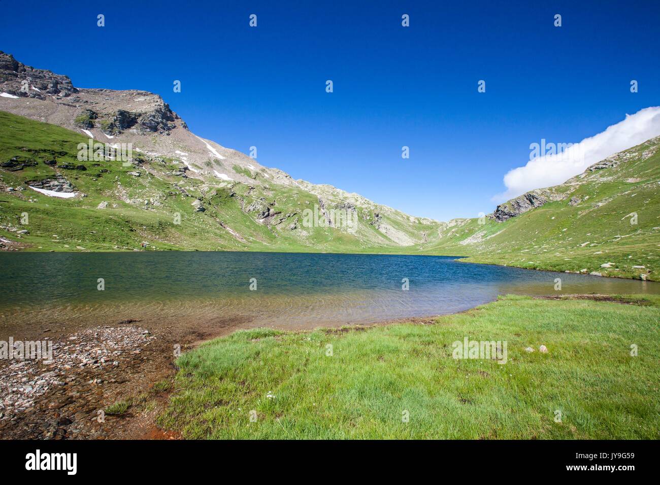Summer contrasts at Baldiscio lake. Campodolcino, Vallespluga, Valchiavenna, Lombardy, Italy Europe Stock Photo