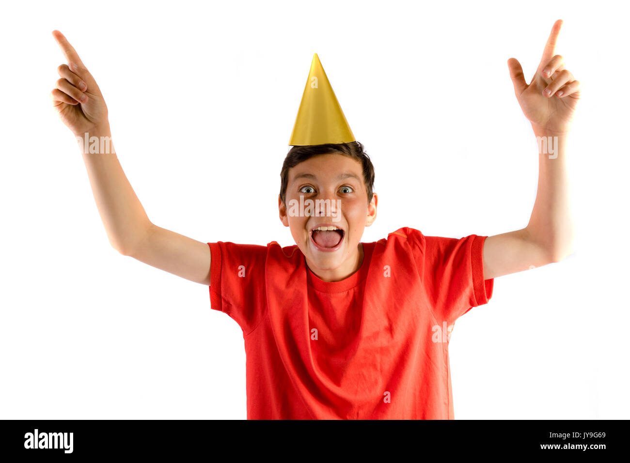 Young teenage boy isolated on white celebrating at a party Stock Photo