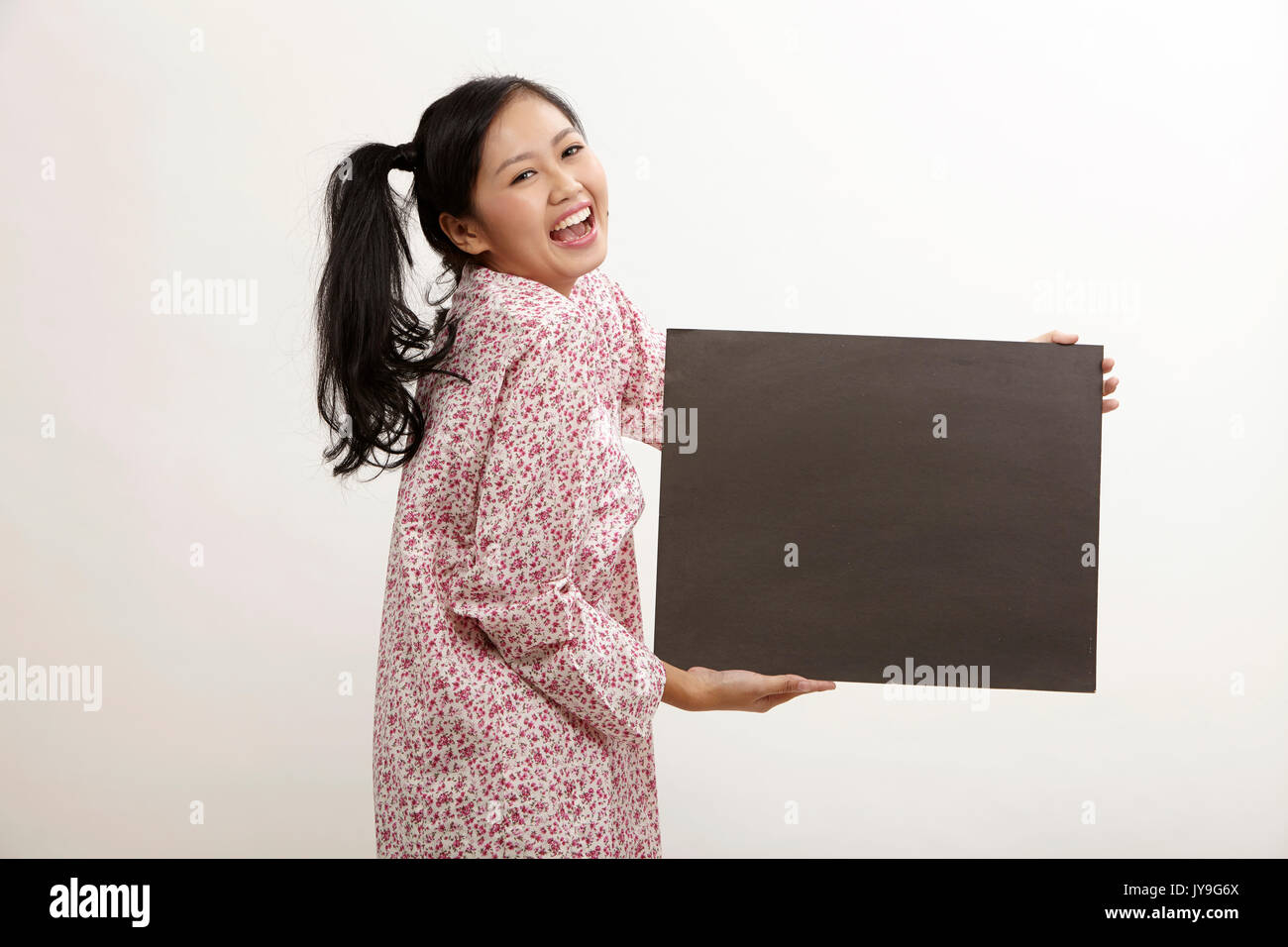 malay woman a holding placard Stock Photo Alamy