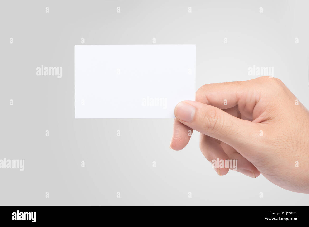 Male hand holding blank business card isolated Stock Photo - Alamy