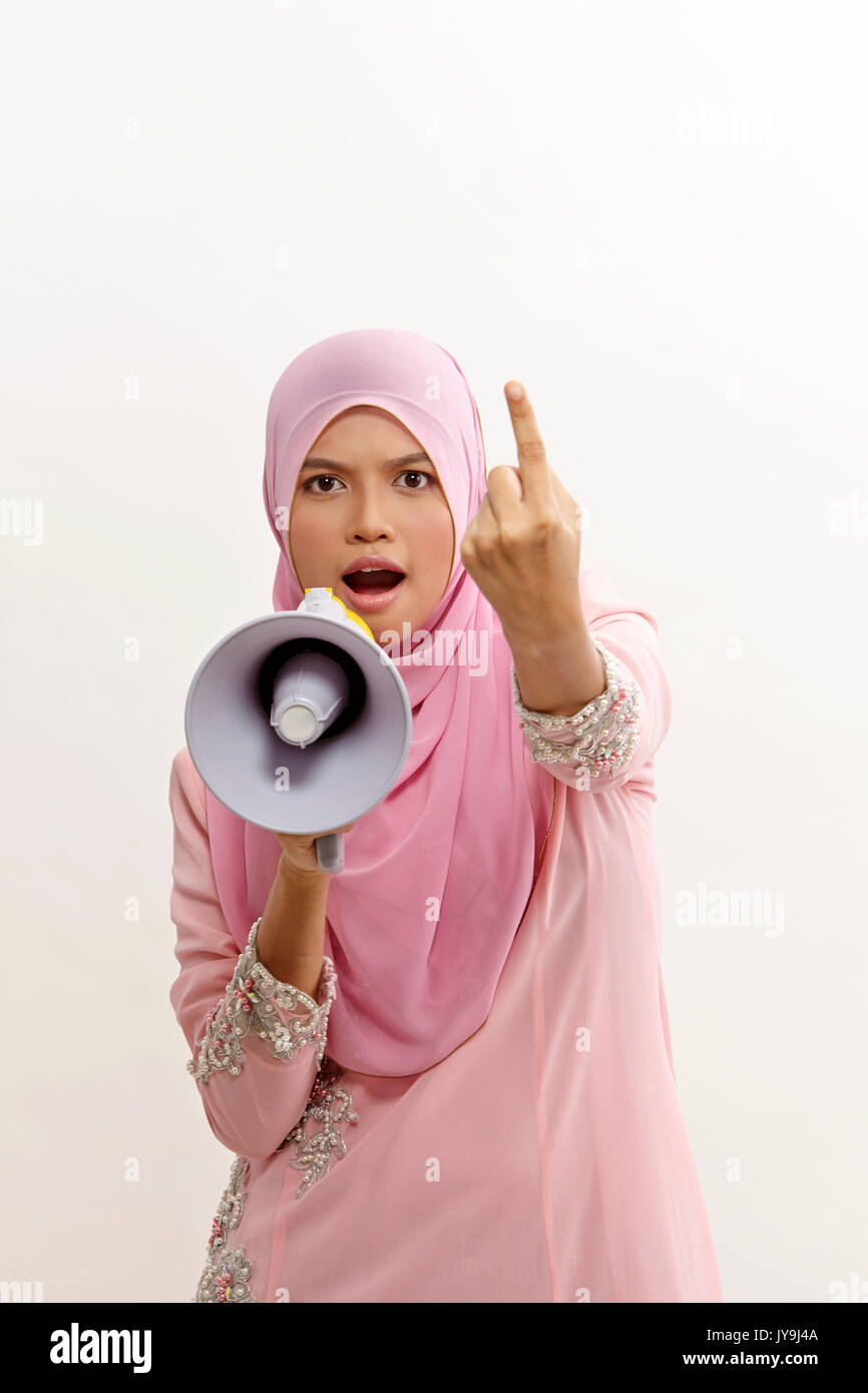 malay woman speaking into a megaphone making a public announcement