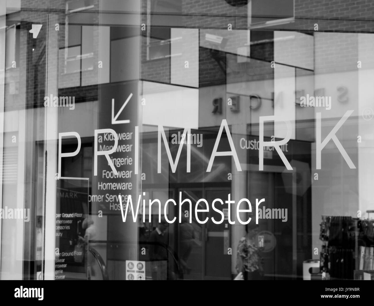 Primark name in shopfront window, Irish low cost clothing and accessories company which is a subsidiary of AB Foods Stock Photo