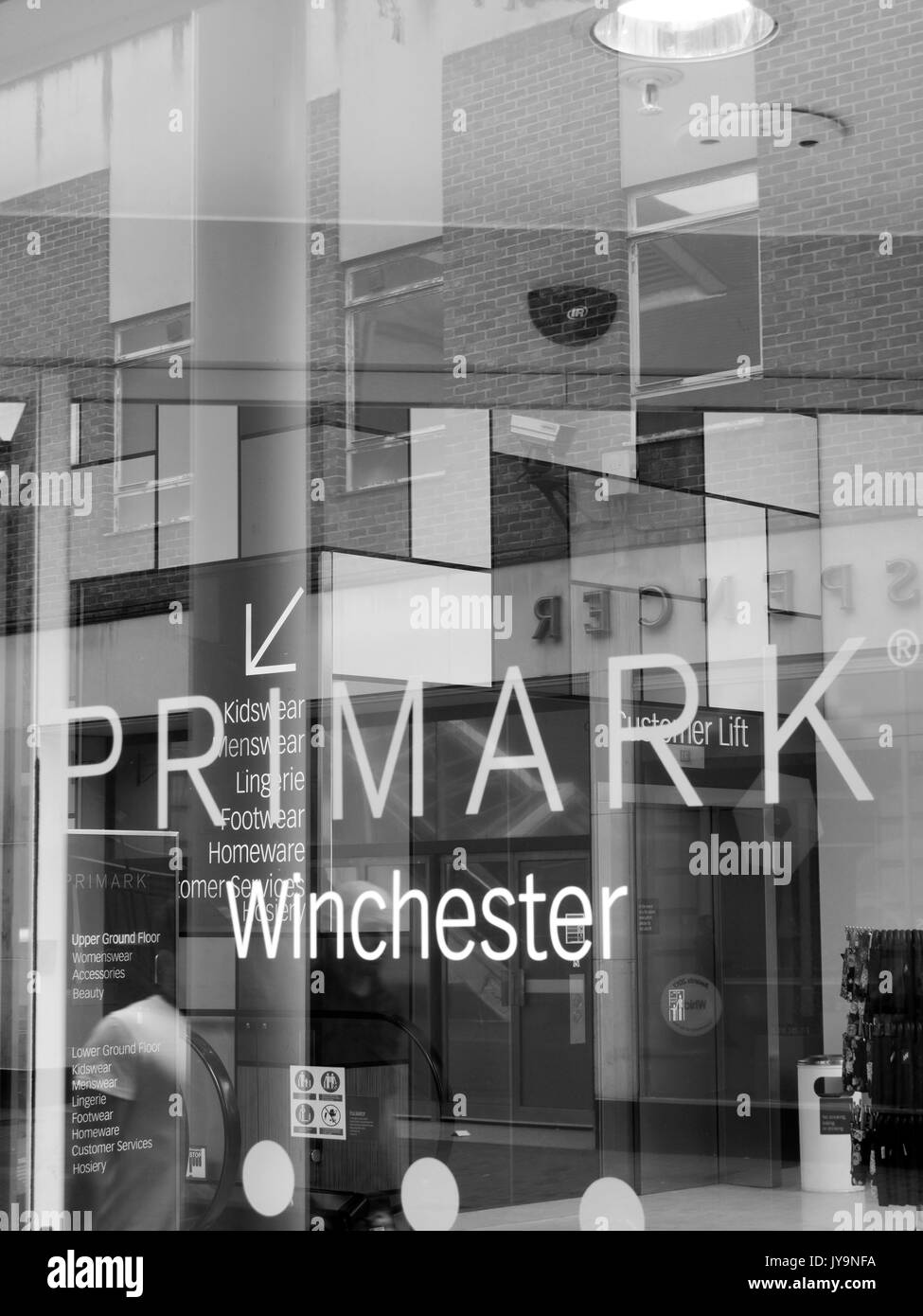 Primark name in shopfront window, Irish low cost clothing and accessories company which is a subsidiary of AB Foods Stock Photo
