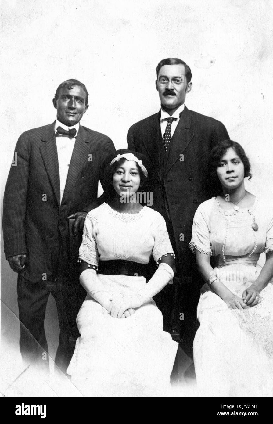 Portrait of African-American family wearing suit and formal dress, in  photographic studio, 1930 Stock Photo - Alamy
