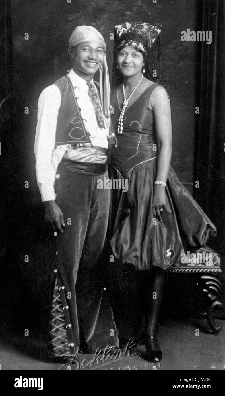 African-American couple, a man and woman, smiling and posing for a portrait in a studio, wearing pirate style costumes, 1925. Stock Photo