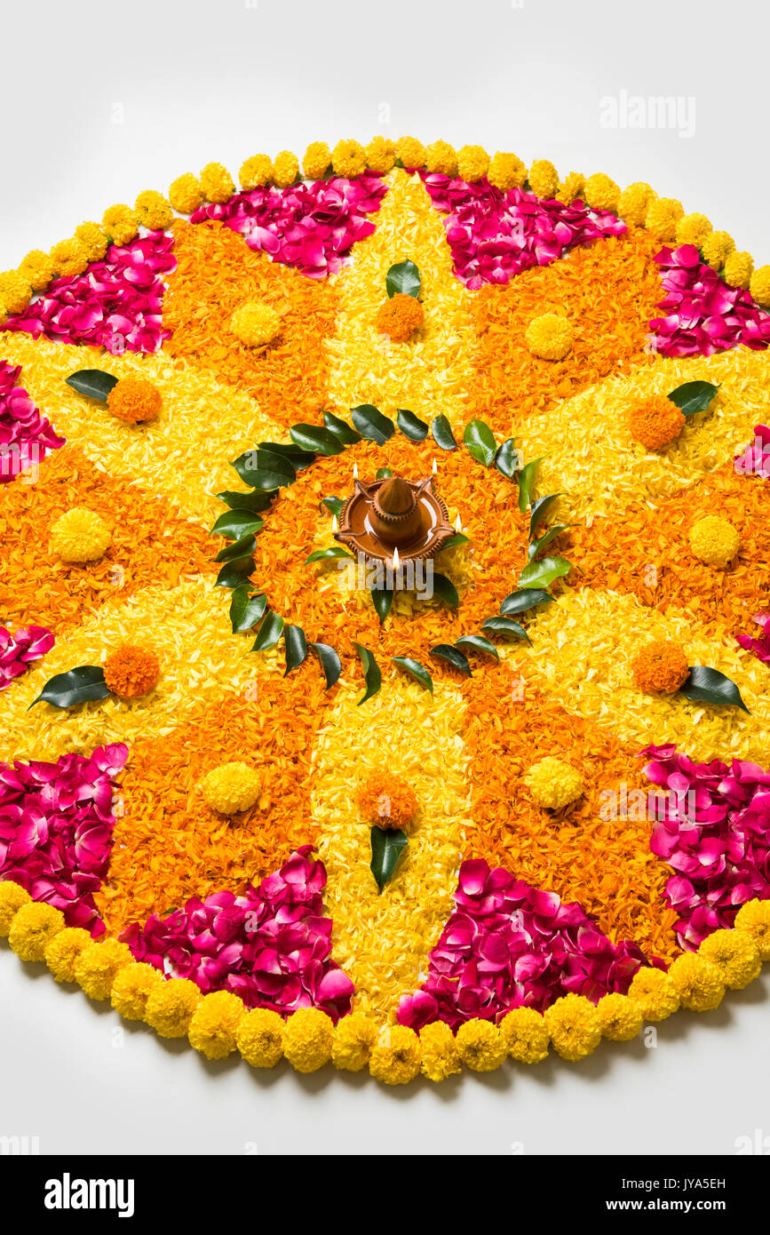 flower rangoli for Diwali or pongal made using marigold or zendu ...