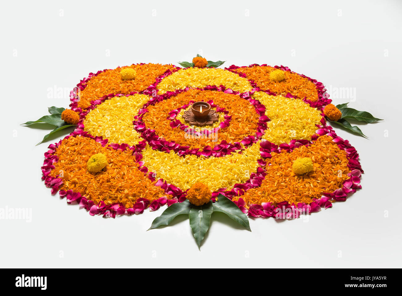 flower rangoli for Diwali or pongal made using marigold or zendu ...