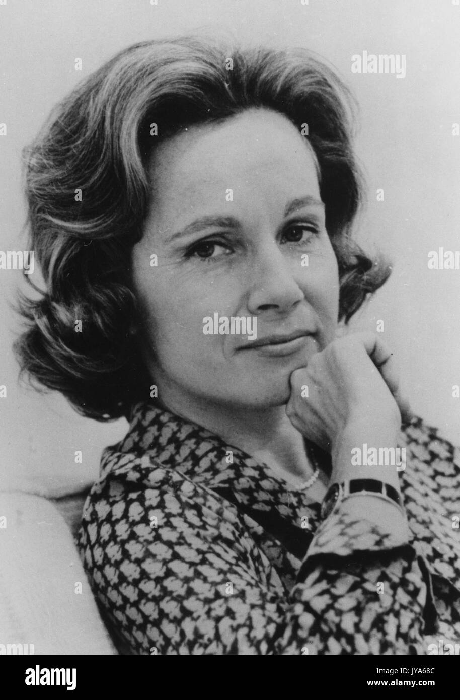A headshot of American journalist Shana Alexander, maturely meeting eyes with the camera with hand on her chin, who spoke at the lecture series Milton S. Eisenhower Symposium at Johns Hopkins University, Baltimore, Maryland. 1975. Stock Photo